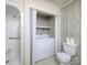 Bathroom includes a shower, toilet, stacked washer-dryer unit, and neutral design at 553 Georgia Ave, Statesville, NC 28677