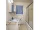This bathroom features a shower with sliding glass door and white cabinet sink with marble counter at 553 Georgia Ave, Statesville, NC 28677