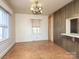 Inviting dining room featuring wood floors and a vintage chandelier at 553 Georgia Ave, Statesville, NC 28677