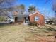 Charming brick home with a cozy front porch and well-maintained lawn at 553 Georgia Ave, Statesville, NC 28677