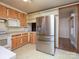 A wide view of the kitchen with lots of cabinet space and a modern stainless steel refrigerator at 553 Georgia Ave, Statesville, NC 28677