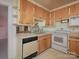 Functional kitchen featuring wood cabinets and a stainless steel sink at 553 Georgia Ave, Statesville, NC 28677
