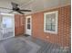 Enjoy this outdoor screened porch with ceiling fan and lattice divider at 553 Georgia Ave, Statesville, NC 28677