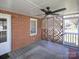 Enjoy this outdoor screened porch with ceiling fan and lattice divider at 553 Georgia Ave, Statesville, NC 28677