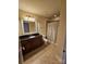 Bathroom features a tiled floor, shower/tub combo and dark vanity at 701 Royal Ct # 309, Charlotte, NC 28202