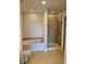Bathroom with soaking tub, walk-in shower, and tile floor at 701 Royal Ct # 309, Charlotte, NC 28202