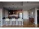 Virtually staged kitchen with island and seating at 701 Royal Ct # 309, Charlotte, NC 28202