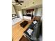 Open concept living area with hardwood floors and an adjacent kitchen featuring stainless steel appliances at 701 Royal Ct # 309, Charlotte, NC 28202