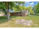 Backyard with a fire pit and a grassy area at 621 Oak Grove Rd, Kings Mountain, NC 28086