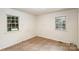 Small bedroom with tile floor and two windows at 621 Oak Grove Rd, Kings Mountain, NC 28086