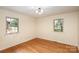 Hardwood floor bedroom with two windows and light walls at 621 Oak Grove Rd, Kings Mountain, NC 28086