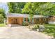 Front view of brick ranch house with light blue shutters and a covered porch at 621 Oak Grove Rd, Kings Mountain, NC 28086