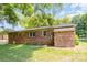 Brick house exterior showcasing a well-maintained lawn and landscaping at 621 Oak Grove Rd, Kings Mountain, NC 28086