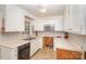 Kitchen with white cabinets, built-in microwave, and tile floor at 621 Oak Grove Rd, Kings Mountain, NC 28086