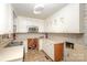 Kitchen with white cabinets, built-in microwave, and tile floor at 621 Oak Grove Rd, Kings Mountain, NC 28086