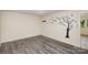 Empty living room with wood-look floors and a wall decal at 621 Oak Grove Rd, Kings Mountain, NC 28086