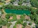 Beautiful aerial view of a pond with trees at 7378 Winery Ln, Charlotte, NC 28227