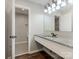 Bathroom with a granite countertop vanity, undermount sink, and a separate toilet area at 7378 Winery Ln, Charlotte, NC 28227
