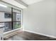 Bright and modern room with dark wood floors and a large window overlooking the neighborhood at 7378 Winery Ln, Charlotte, NC 28227