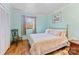 Bedroom with light walls, wood floors, and built in closet at 915 Timberlane Dr, Mount Holly, NC 28120