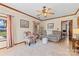 Cozy living room featuring hardwood floors, a ceiling fan, and neutral decor at 915 Timberlane Dr, Mount Holly, NC 28120