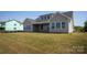 Expansive backyard featuring a covered patio and large windows, perfect for outdoor living and natural light at 4679 Hopsack Dr # Cal0108, Indian Trail, NC 28079
