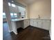 Bright bar area features white cabinets and stone countertops, perfect for entertaining at 4679 Hopsack Dr # Cal0108, Indian Trail, NC 28079