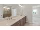 Bathroom with a large mirror, double sinks, and a walk-in shower at 4679 Hopsack Dr # Cal0108, Indian Trail, NC 28079