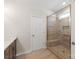 Modern bathroom featuring a glass shower with a built-in bench and wood-look tile at 4679 Hopsack Dr # Cal0108, Indian Trail, NC 28079