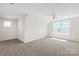 Bedroom with neutral carpet, windows, and a ceiling fan at 4679 Hopsack Dr # Cal0108, Indian Trail, NC 28079