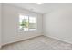 Bright bedroom featuring a window with natural light and neutral carpeting at 4679 Hopsack Dr # Cal0108, Indian Trail, NC 28079