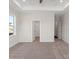 Spacious bedroom with neutral walls, plush carpeting, and an open doorway at 4679 Hopsack Dr # Cal0108, Indian Trail, NC 28079