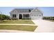 Charming craftsman-style home with a manicured lawn and welcoming front porch at 4679 Hopsack Dr # Cal0108, Indian Trail, NC 28079