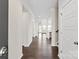 Bright hallway with hardwood floors leading to various rooms at 4679 Hopsack Dr # Cal0108, Indian Trail, NC 28079