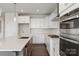 Bright kitchen showcasing white cabinetry, stainless steel appliances, subway tile backsplash, and a center island at 4679 Hopsack Dr # Cal0108, Indian Trail, NC 28079