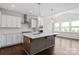 Stylish kitchen with a center island, stainless steel appliances, and views to breakfast nook at 4679 Hopsack Dr # Cal0108, Indian Trail, NC 28079