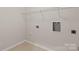 Utility room including storage, with tile floors and room for laundry machines at 4679 Hopsack Dr # Cal0108, Indian Trail, NC 28079