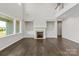 Spacious living room with a fireplace, built-in shelves, and hardwood floors at 4679 Hopsack Dr # Cal0108, Indian Trail, NC 28079