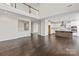 Spacious living room flowing into the kitchen, featuring hardwood floors and an open-concept design at 4679 Hopsack Dr # Cal0108, Indian Trail, NC 28079