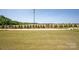Lush green yard featuring a sidewalk and bordering trees, perfect for outdoor enjoyment and scenic views at 4679 Hopsack Dr # Cal0108, Indian Trail, NC 28079