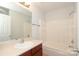 Bright bathroom features a white shower, neutral walls, and a vanity with chrome hardware at 1125 Kurt Ct, Charlotte, NC 28209