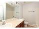 The bathroom has double sinks, a large mirror, and a vanity with storage at 1125 Kurt Ct, Charlotte, NC 28209