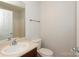 Bright bathroom features a white shower, neutral walls, and a vanity with chrome hardware at 1125 Kurt Ct, Charlotte, NC 28209