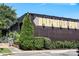 Charming pub exterior with lush greenery, sidewalk seating, and rustic architectural details at 1125 Kurt Ct, Charlotte, NC 28209