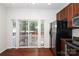 This kitchen features stainless steel appliances, granite countertops, and sliding glass doors to the home's exterior at 1125 Kurt Ct, Charlotte, NC 28209