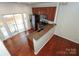 Bright kitchen with stainless appliances, granite counters, wood cabinets and sliding door to deck at 1125 Kurt Ct, Charlotte, NC 28209