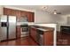 Kitchen features stainless steel appliances, wooden cabinets, granite countertops, and a stainless steel sink at 1125 Kurt Ct, Charlotte, NC 28209