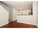 Open concept living area with hardwood floors next to the staircase at 1125 Kurt Ct, Charlotte, NC 28209