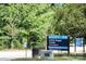 Little Sugar Creek Greenway sign with trees and green foliage in the background at 1125 Kurt Ct, Charlotte, NC 28209