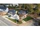 Aerial view of two new construction homes with sodded lawns and long driveways on a sunny day at 4023 Randolph Rd, Charlotte, NC 28211